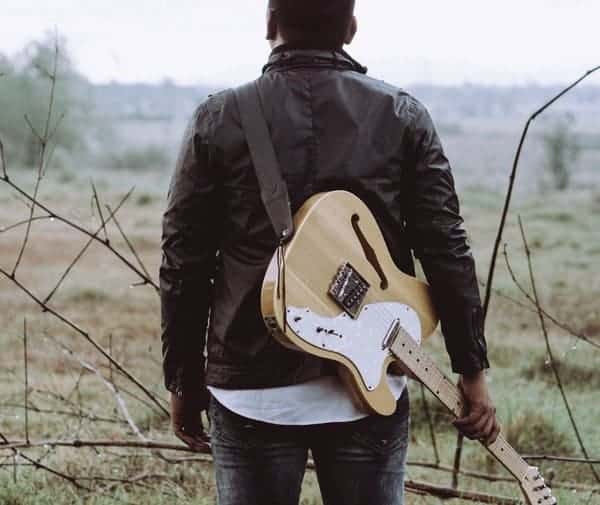 guitarist in the wilderness symbolising being isolated