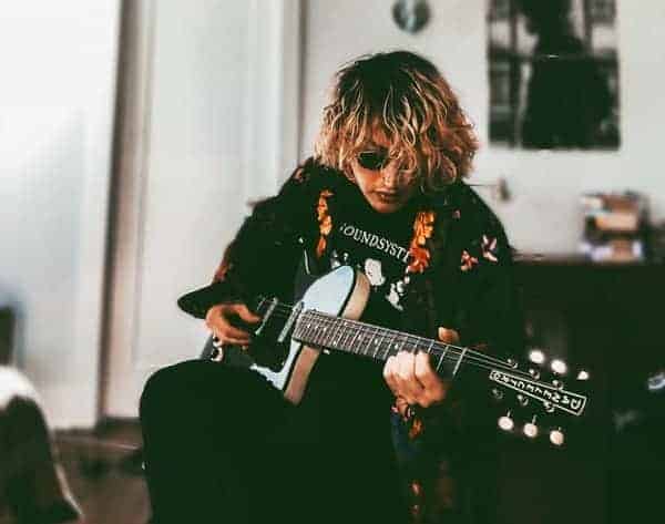 guitarist practising at home