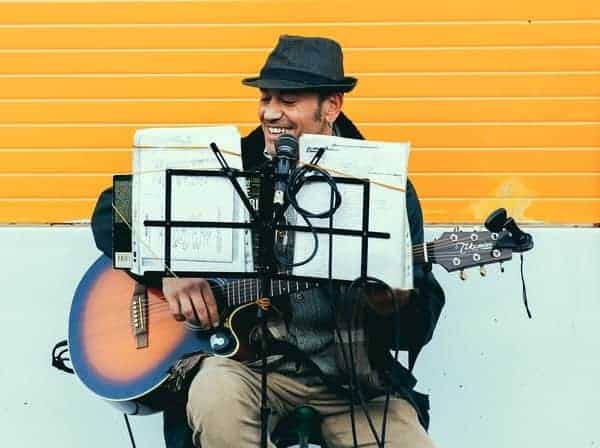 guitarist playing using music theory and notation