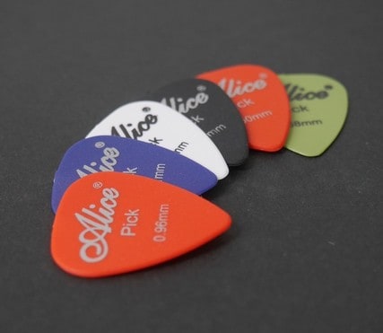 several guitar picks on a table